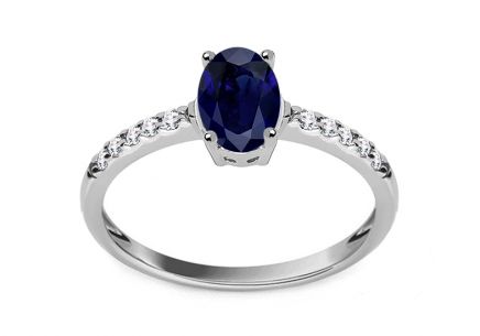 Weißgoldring mit simuliertem Saphir und klaren Zirkonen